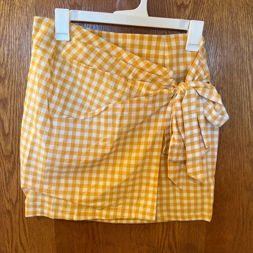 Yellow, mini skirt, with front tie and back zipper size M